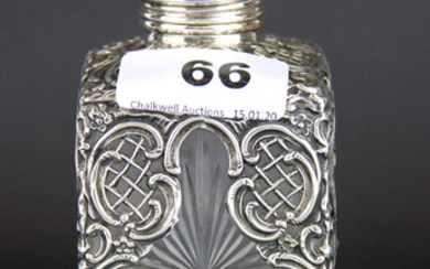 A hallmarked silver decorated cut glass perfume bottle, H. 13cm.