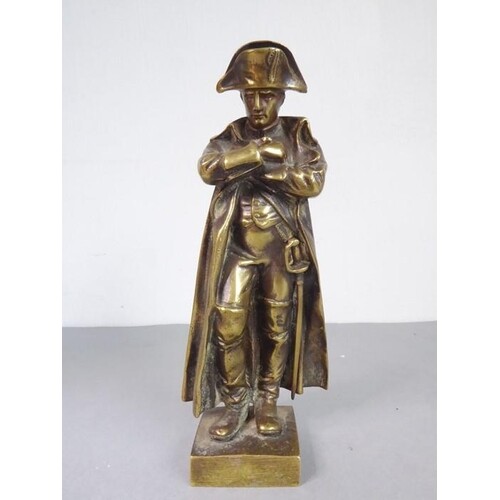 A heavy 19th century cast-brass model of Napoleon; in full u...