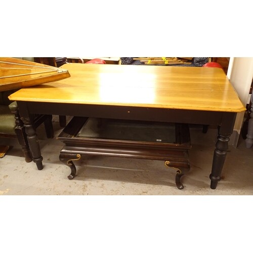 A large polished and painted pine kitchen table, on baluster...