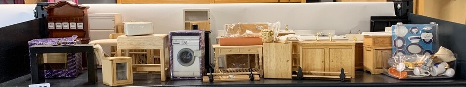 A large quantity of dolls house kitchen items.