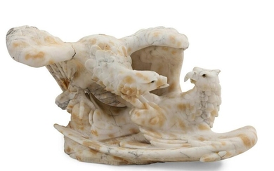 A marble figural group of battling eagles