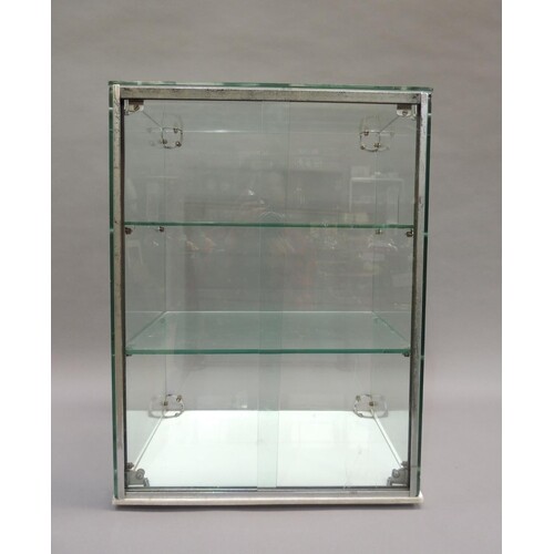 A mid 20th century glass and chrome cake display case, with ...
