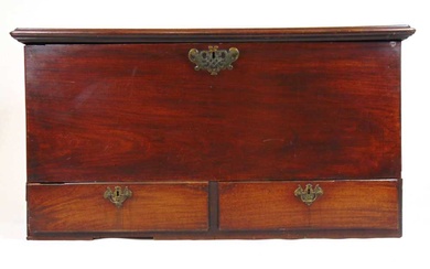 A mid-18th century mahogany mule chest, the top lifting to...