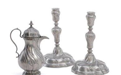 A pair of 18th century Rococo pewter candlesticks of spiral fluted form,...