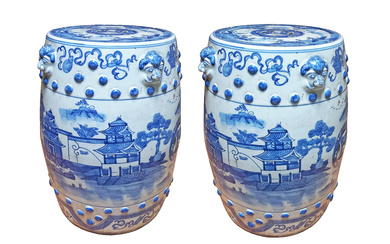 A pair of Chinese blue and white barrel shaped stools