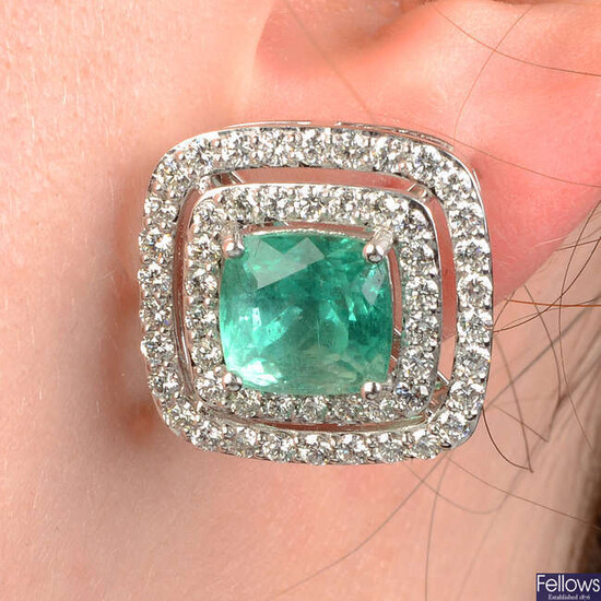 A pair of emerald and brilliant-cut diamond earrings.