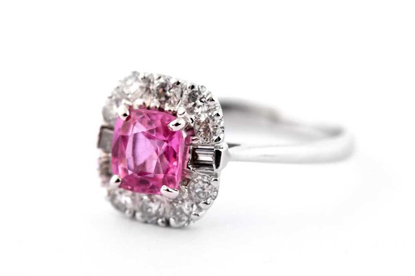 A pink sapphire and diamond cluster ring