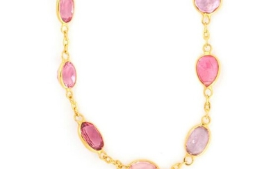 A pink sapphire and eighteen karat gold necklace