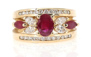 A ruby and diamond ring set with an oval-cut and two marquise-cut...