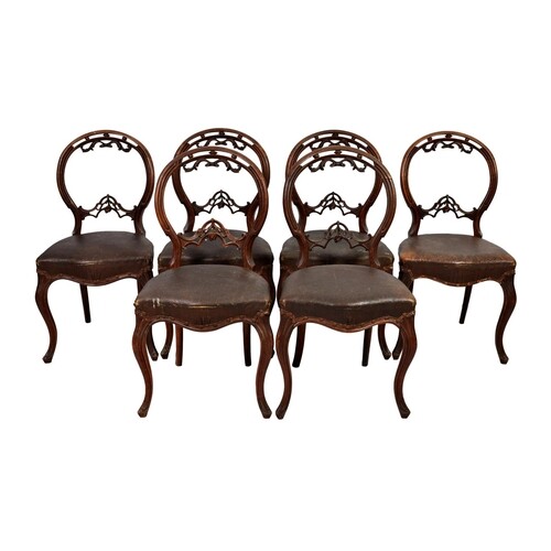 A set of six Victorian walnut balloon back dining chairs, th...