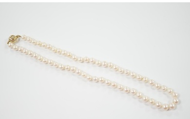 A single strand cultured pearl necklace with 18K and diamond...