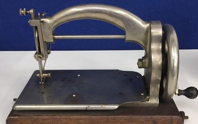 A vintage 'Ideal' sewing machine, with metal carry-case.