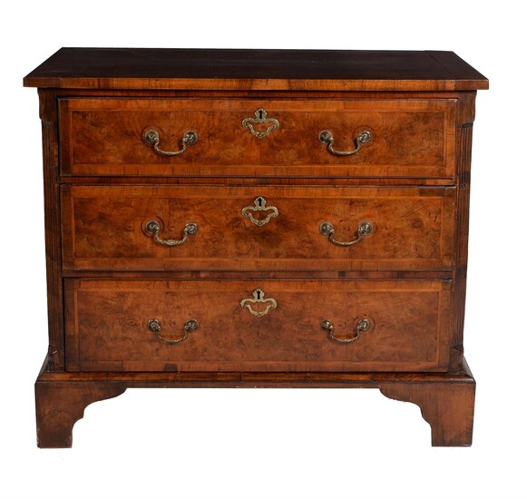 A walnut and feather banded chest of drawers