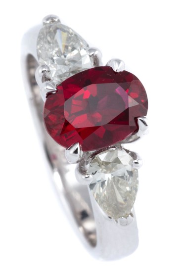 AN 18CT WHITE GOLD DIAMOND AND STONE SET RING; centring an oval cut synthetic ruby adjacent to 2 pear brilliant cut diamonds totalli...