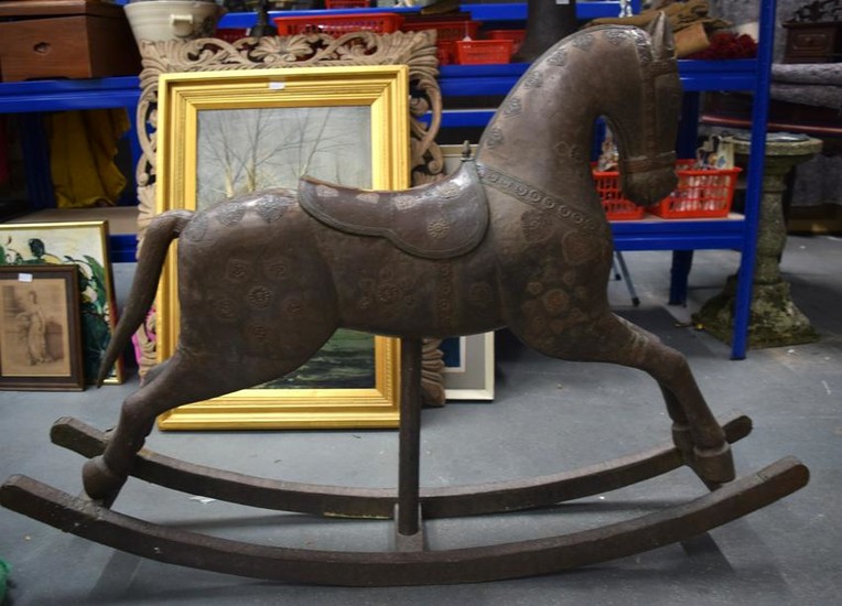 AN ANTIQUE INDIAN COPPER PANEL WOODEN ROCKING HORSE