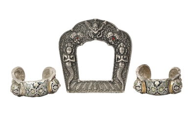 AN ENGRAVED SILVER FRAME AND A PAIR OF CHAMPLEVÃ‰ ENAMELLED SILVER BRACELETS Thailand or Laos...