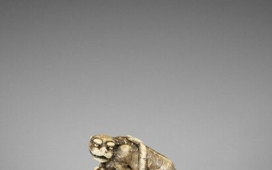 AN EXCELLENT KYOTO SCHOOL IVORY NETSUKE OF A TIGER ON BAMBOO