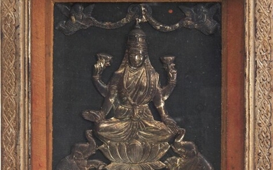 AN INDIAN SILVER REPOUSSE IMAGE OF GAJALAKSHMI CIRCA LATE 19TH/EARLY 20TH CENTURY
