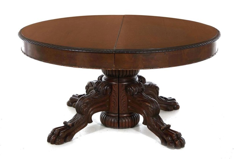 American carved mahogany paw-foot dining table