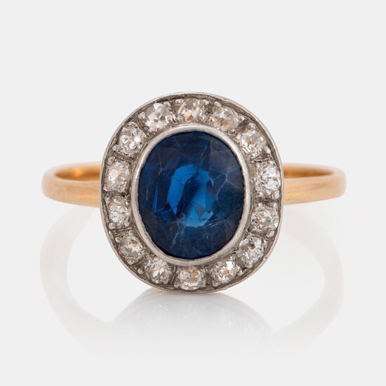 An 18K gold ring set with a faceted sapphire weight ca 2.00 cts and old-cut diamonds
