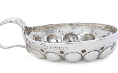 An 18th century French provincial silver wine taster, OrlÃ©ans, maker's mark ET, possibly Etienne Tremblay, the rim scratch engraved 'Gorge Henavlt', 8.5cm dia., approx. weight 3.3oz Provenance: Works of Art from the Schroder Collection.