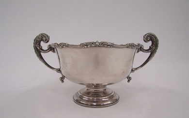 An Adie Bros silver twin handled pedestal bowl, shaped edge ...