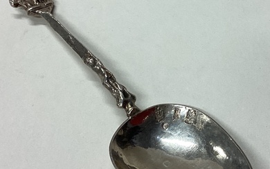 An Antique Dutch silver spoon with figural handle.