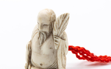 An Antique Japanese Carved Ivory Netsuke of a Chinese Sage