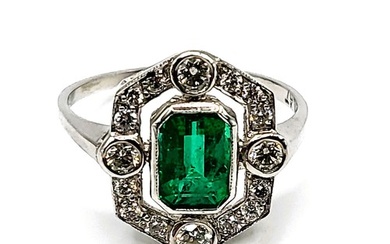 An Art Deco style platinum, emerald, and diamond ring, set w...