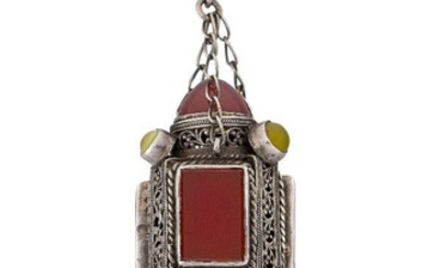 An Arts & Crafts silver and hardstone pendant necklace, the pendant of pierced hexagonal form, three sides set with a single rectangular cornelian, with circular cabochon cornelian terminals and circular and heart shaped cabochon pale yellow gem...