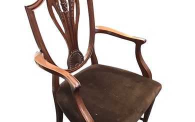 An Edwardian mahogany Hepplewhite style armchair, the shield shaped back...
