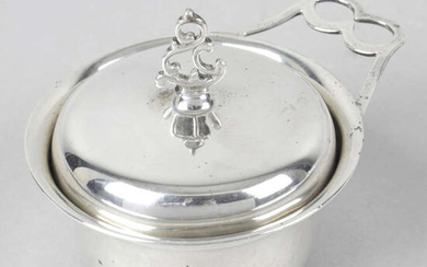 An Edwardian silver lidded pot with single handle, inset with a George II coin.