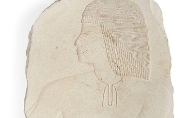 An Egyptian style limestone relief fragment with the profile bust of a male with well delineated eyes and finely layered wig and necklace, Not Ancient, 23.8cm x 20cm Provenance: Formerly in the private collection of Werner Forman (1915-2010)