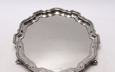 An Elizabeth II silver presentation salver, with engraved in...