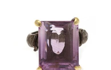 An amethyst ring set with an emerald-cut amethyst, mounted in black rhodium plated and partly gilded sterling silver. Size 56.