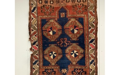 An antique Caucasian blue ground rug, 160 x 115cm