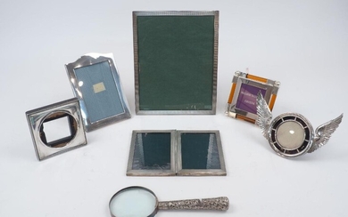 An assortment of silver photo frames, including a late Victorian example, 1895, designed with wings and an inscription reading 'a friend in need is a friend indeed', 18.6cm wide (inc. wings); and a rectangular engine turned example, Birmingham...