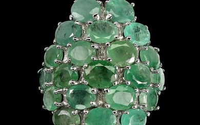 An emerald ring set with numerous oval-cut emeralds, mounted in rhodium plated sterling silver. Str. 57.