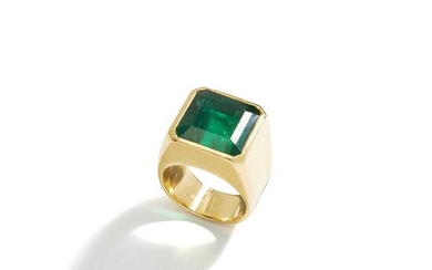 An emerald single-stone ring