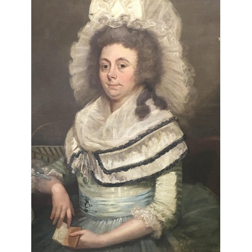 An unframed early 19th century portrait of a lady with lace ...