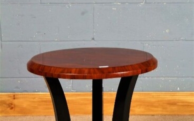 Art Deco style side table, having walnut effect circular top raised on ebonised shaped legs and