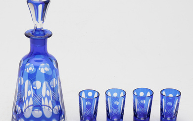 Bohemia liquor set in cobalt-doubled and carved glass, 20th Century.
