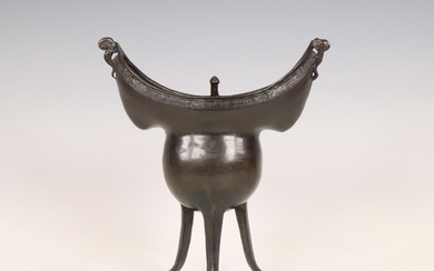 China, a bronze tripod ritual wine vessel, yue, Yuan or early Ming dynasty, 14th/ 15th century