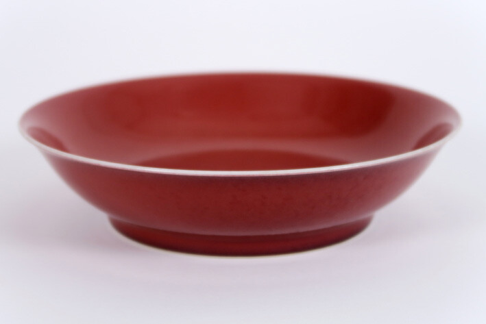 Chinese dish in marked porcelain with an oxblood...