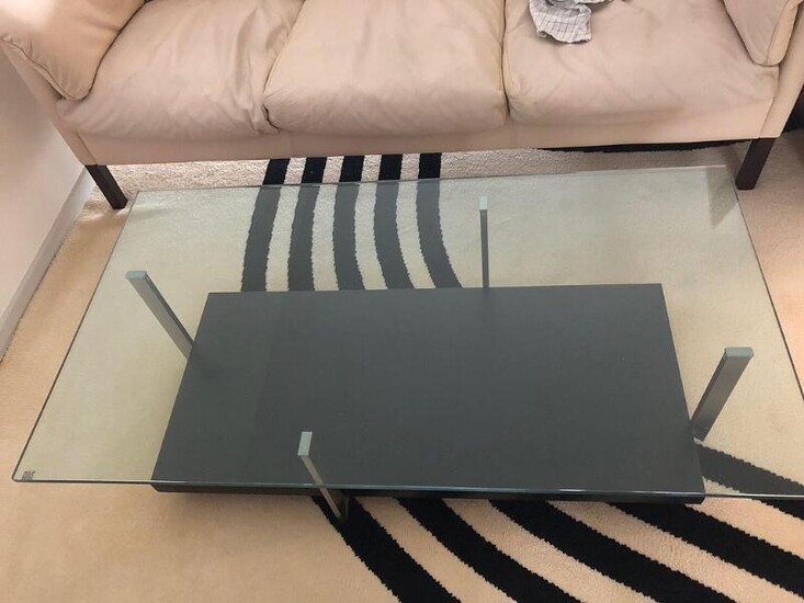 NOT SOLD. Christian Werner: Coffee table with brushed steel frame, glass top and underlying shelf with black laminate. Designed 2004. Manufactured by Rolf Benz. – Bruun Rasmussen Auctioneers of Fine Art