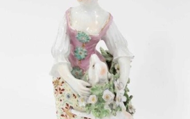 Derby figure of a shepherdess, circa 1760-65, polychrome and gilt decorated, shown garlanding a lamb, standing on a floral encrusted base, patch marks to base, 19.5cm high