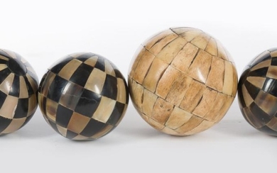 FOUR ORNAMENTAL SPHERES INLAID IN HORN AND BONE, LARGEST 12CM DIAMETER