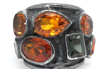 SOLD. Gerda Lynggaard: An idocrase and sapphire ring set with three idocrases and numerous orange sapphires, mounted in silver. Size app. 58. – Bruun Rasmussen Auctioneers of Fine Art