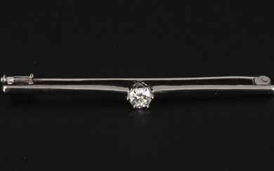 Gold tie clip with solitaire diamond.