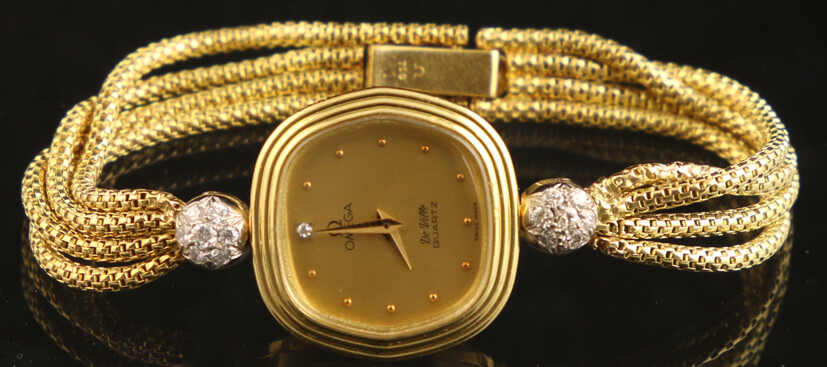 Golden watches (working not guaranteed) - 18k yellow gold cocktail watch, Omega De Ville, the lugs decorated with two white-gold spheres set with single-cut diamonds - 22 mm, 17 cm